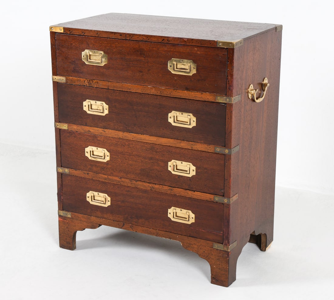 CAMPAIGN STYLE MAHOGANY CHEST C. 1960S: Brass hardware and accents. Dimensions: H 28"x W 24" x D 13" Condition: Slight surface scuffs and marks. Tarnishing to brass. Wear consistent with age and use.