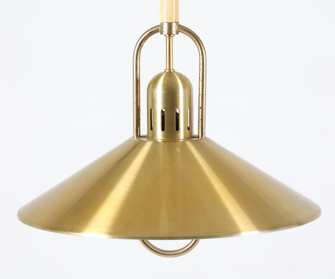BELID DANISH SAUCER PENDANT LIGHT C. 1970S: Brass toned metal saucer pendant light with handle and pulley system for height adjustment. Dimensions: H 14" x Dia. 16.25". Conditions: Wiring untested. Minor scuffs and scratches. Wear consistent wi