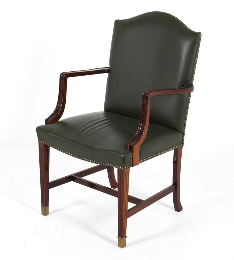 MID-CENTURY DANISH LEATHER ARMCHAIR C. 1960S: Green-tone leather upholstery with tack edges. Brass caps to feet. Dimensions: H 36.5" x W 21" x D 20". SH 18" Condition: Minor nicks and scuffs to armrests and legs. Presents well overall. DDE C