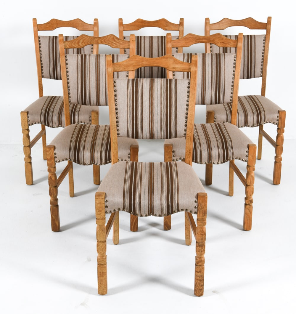 6 HENNING KJAERNULF STYLE DANISH OAK DINING CHAIRS: Carved front legs. White-tone wool upholstery with tack edges. Dimensions: H 37" x W 18" x D 17.5", SH 18" Condition: Scattered areas of discoloration and sun fading to frames. Presents well overall.
