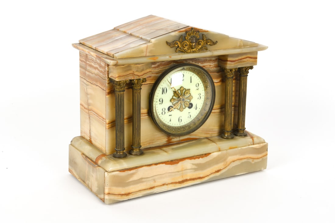ANTIQUE FRANCH ONYX & GILT-BRONZE MANTLE CLOCK: French Onyx with stepped pediment and gilt-bronze appliques mantle clock. With inscriptions and notes on side. Key included. 20th century. Dimensions: H 10" x W 12" x D 6" Condition: Wear consistent w