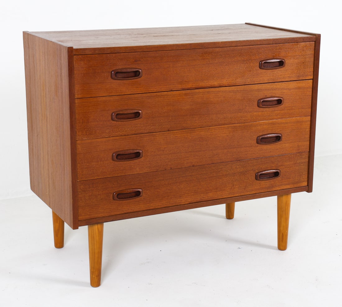 ATTR. ARNE VODDER TEAK CHEST OF DRAWERS C. 1960S: Teak chest of drawers with molded inset drawer pulls in the style of Arne Vodder for Sibast Mobler. Denmark, circa 1960s. Dimensions: H 27.5" x W 31.5" x D 16.5". Condition: Minor scuffs and rubs. Wea
