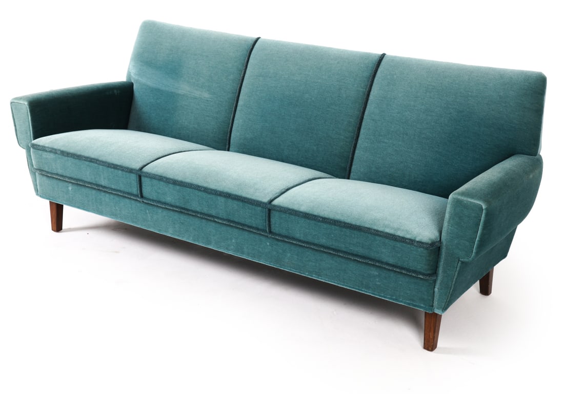 MID-CENTURY DANISH MOHAIR SOFA C. 1960S: Sofa with blue mohair upholstery and rope fringe. Denmark, circa 1960s. Dimensions: H 30.5" x W 75" x D 28.5" x Sh 15". Conditions: Few scuffs and worn spots to mohair on top edge of back. Scuffs to l