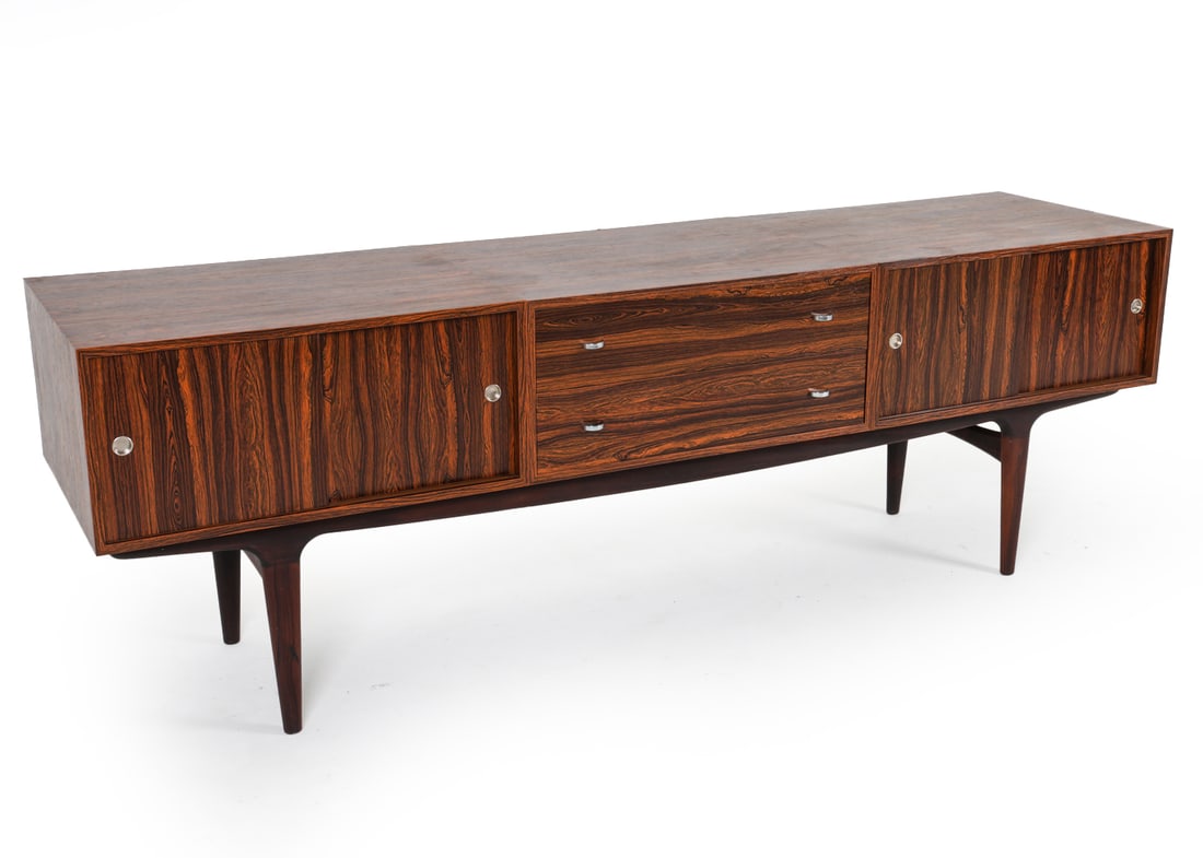 SCANDINAVIAN ROSEWOOD SIDEBOARD C. 1960S: Rosewood veneer with metal cabinet and drawer pulls. Circa. 1960s. Dimensions: H 28.5" x W 85.5" x D 21". Condition: Minor surface scratches to wood. Wear consistent with age and use. DMR092