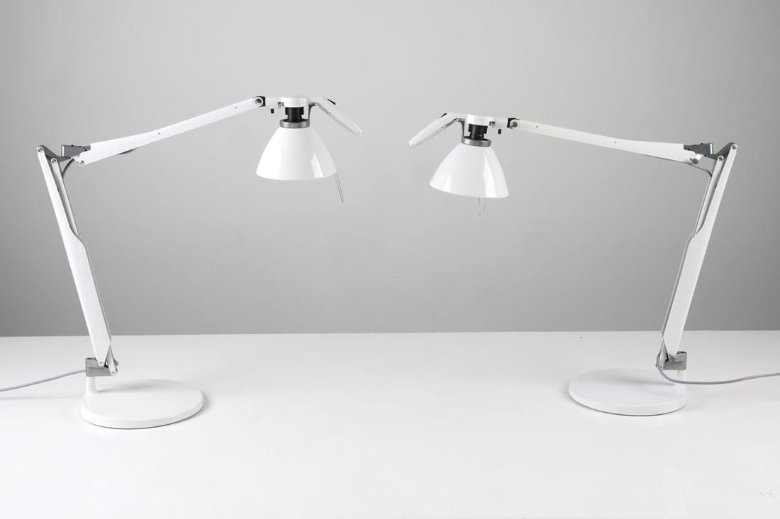 PAIR OF LUCEPLAN 'FORTEBRACCIO' ARCHITECT LAMPS: Designed by Alberto Meda and Paolo Rizzatto for Luceplan. Marked to stand and inside of shade. Italy, circa 1980s. Dimensions: Approx. H 21" x W 29" x Dia. Base 9.25". Condition: Wiring untested, Euro