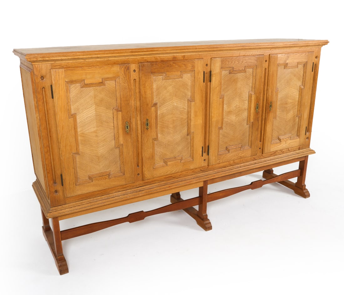 HENNING KJAERNULF STYLE DANISH OAK SIDEBOARD 1970S: Key included. Adjustable shelves. Carved decoration to cabinet doors. Denmark, circa 1970s. Dimensions: H 46.5" x W 78" x D 18". Condition: Minor scuffs and scratches. Wear consistent with age and use
