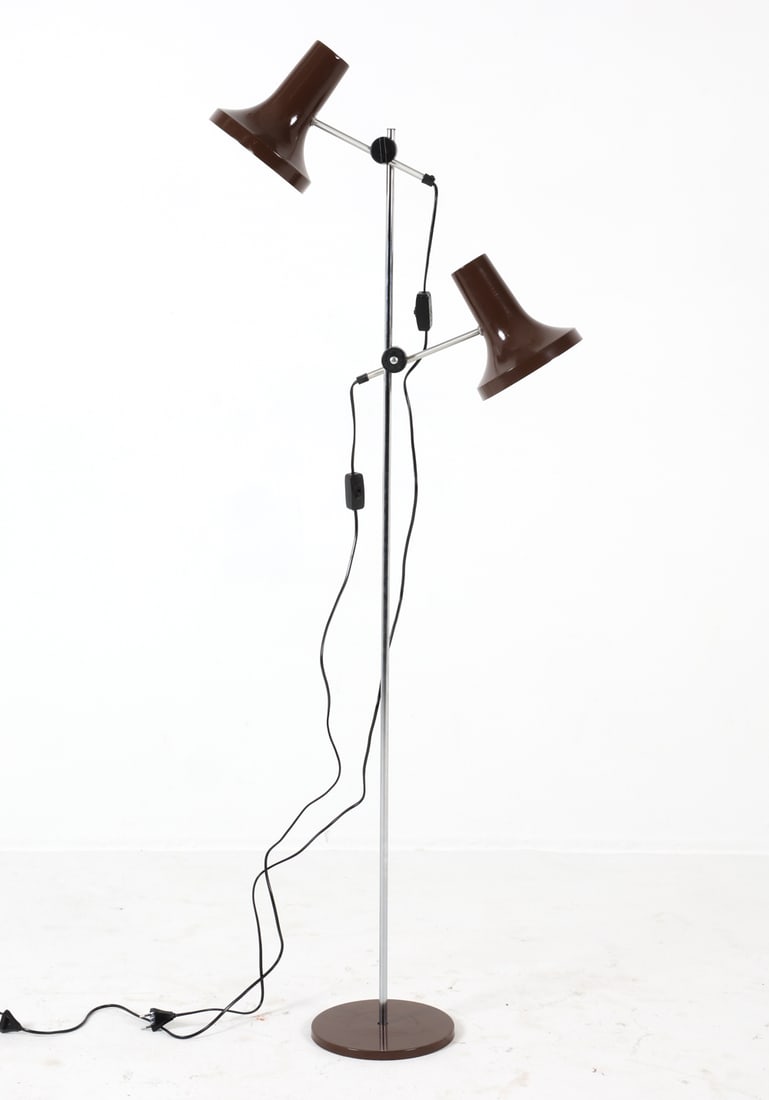 JO HAMMERBORG STYLE CHROME FLOOR LAMP C. 1960S: Floor lamp with (2) adjustable lamp heads in the style of Jo Hammerborg. Chrome steel stand. Cast iron weighted base. Denmark, circa 1960s. Dimensions: H 64.5" x Dia. 16". Condition: Wiring untested,