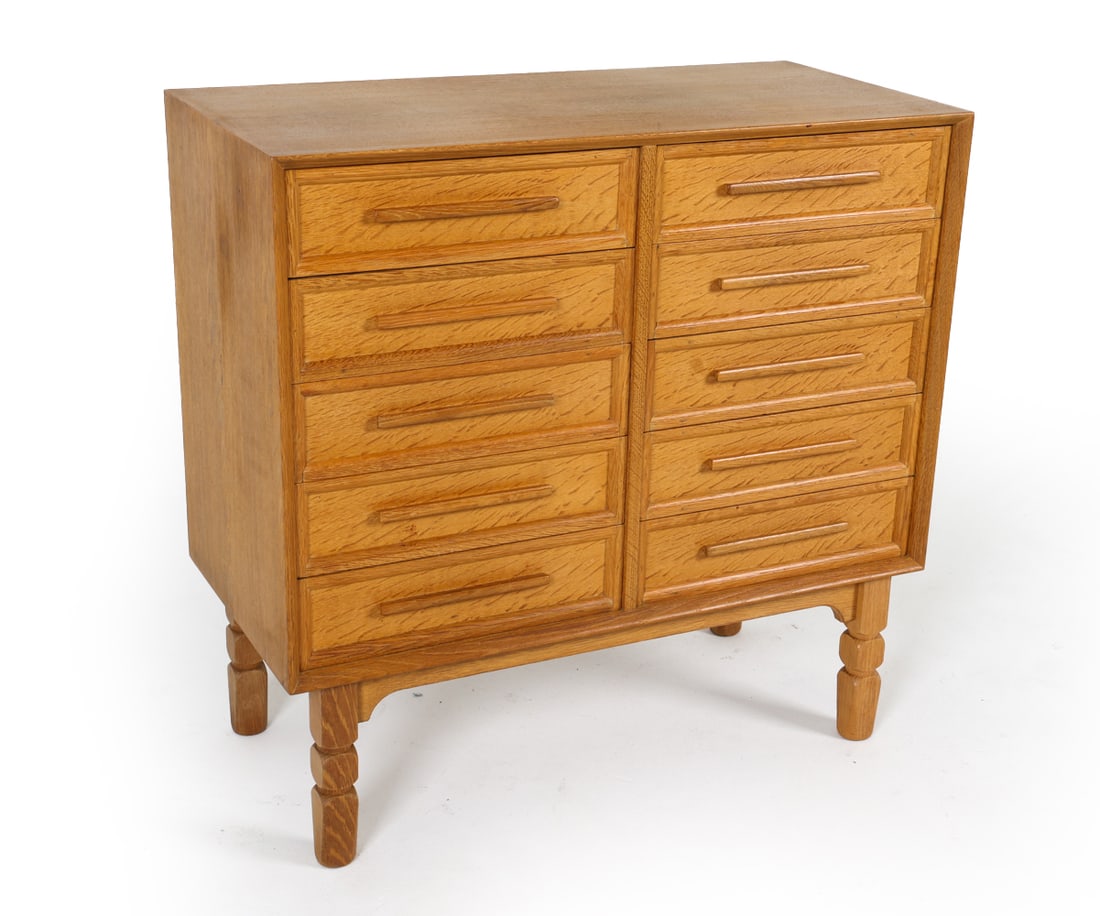 MID-CENTURY DANISH OAK CHEST OF DRAWERS C. 1970S: Oak chest of drawers with elongated drawer pulls. Denmark, circa 1970s. Dimensions: H 34" x W 34.75" x D 16.5". Conditions: Light surface wear consistent with age and use. Wear consistent with age and