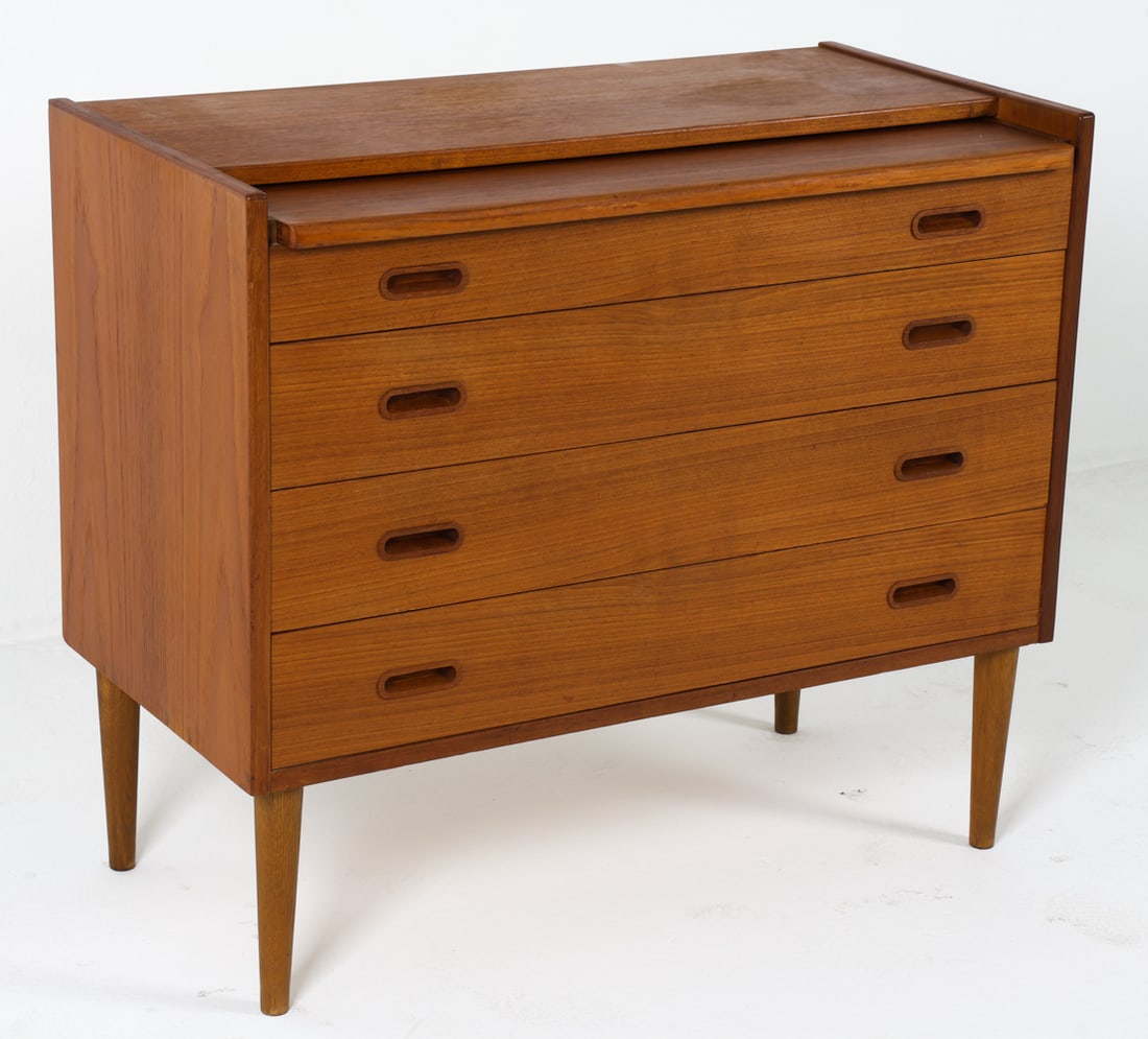 CARLO JENSEN STYLE TEAK SECRETARY CHEST C. 1960S: Chest of drawers with pull out desk that flips upwards to open in the style of Carlo Jensen. Organizing compartments inside. Denmark, circa 1960s. Dimensions: H 30.75" x W 35.5" x D 17.75". Desk D 16"