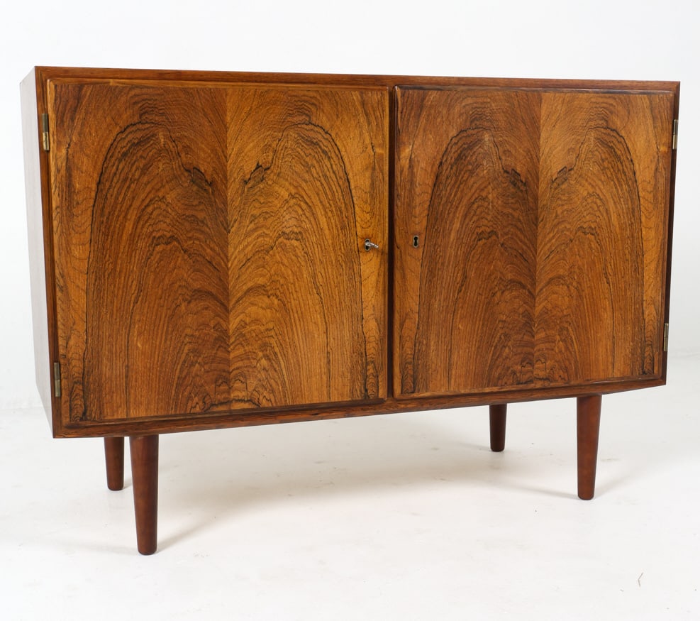 HUNDEVAD DANISH ROSEWOOD CREDENZA C. 1960S: Key included. Adjustable shelves and drawers inside. Stamped to the back top corner. Denmark, circa. 1960s. Dimensions: H 29.5" x W 42.75" x D 17". Condition: Minor scuffs and scratches. Wear consiste