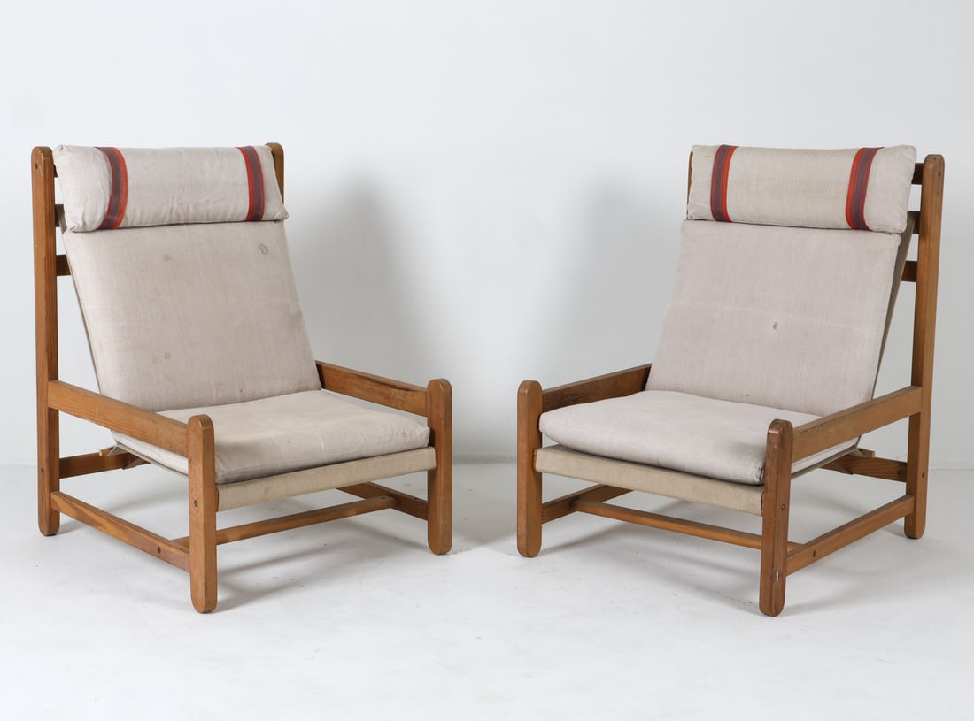NIELS EILERSEN PINE SAFARI LOUNGE CHAIRS: Pair of pine lounge chairs with linen fabric upholstery by Niels Eilersen. Sling fabric seat. Unmarked. Denmark, circa 1960s. Dimensions: H 40" x W 27.75" x D 33.25" x SH 15.75". Condition: Few discol