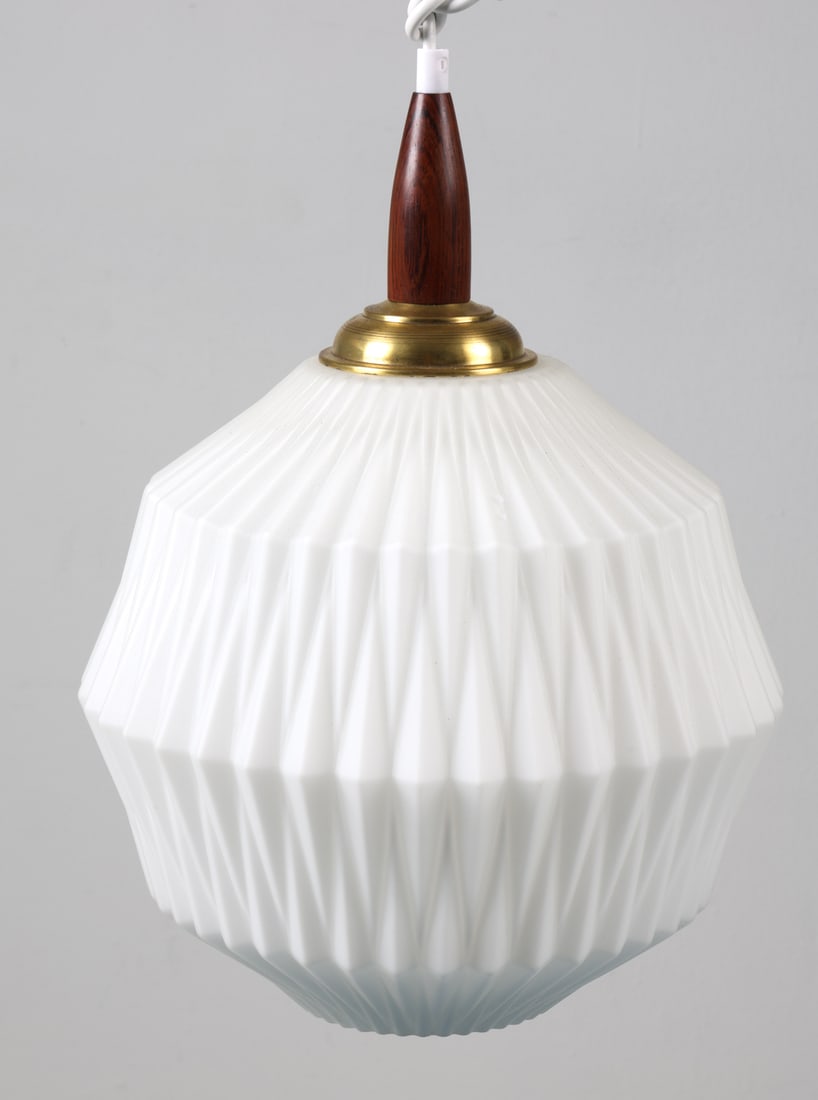 LE KLINT STYLE TEAK & GLASS PENDANT LIGHT: Pendant light with milk glass shade with teak cap. Brass toned metal. Denmark, circa 1960s. Dimensions: H 16" x Dia. 11". Condition: Wiring untested. Minor scuffs to metal and wood. Wear consistent wi