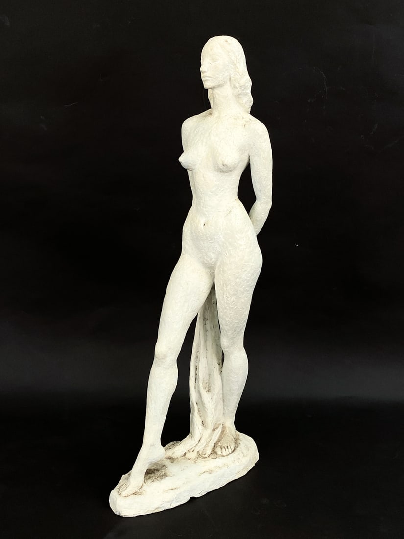 FEMALE NUDE PLASTER SCULPTURE: Plaster sculpture of a nude woman posing. Signed on base. Dimensions: H 30" x W 6 1/2" x D 12 1/2" Condition: Light chips and cracks, possible repair to base, consistent with age.