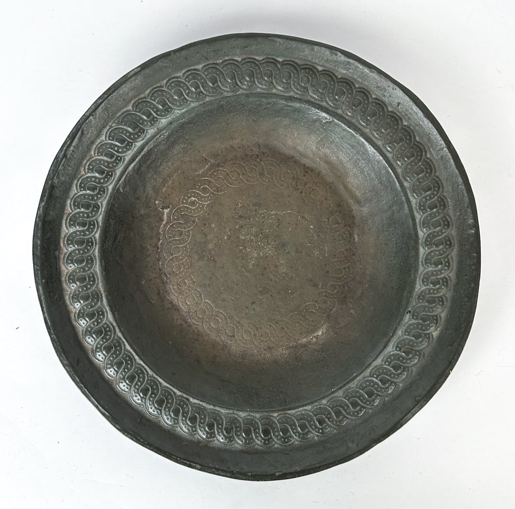 MEDIEVAL HEAVY BRONZE SHALLOW DISH: Heavy bronze shallow dish with rope design motif. Dimensions: H 1.5" x Dia 12" Condition: Casting irregularities mainly to back, wear to cavetto. Overall deep olive patina, slightly more brown on inte