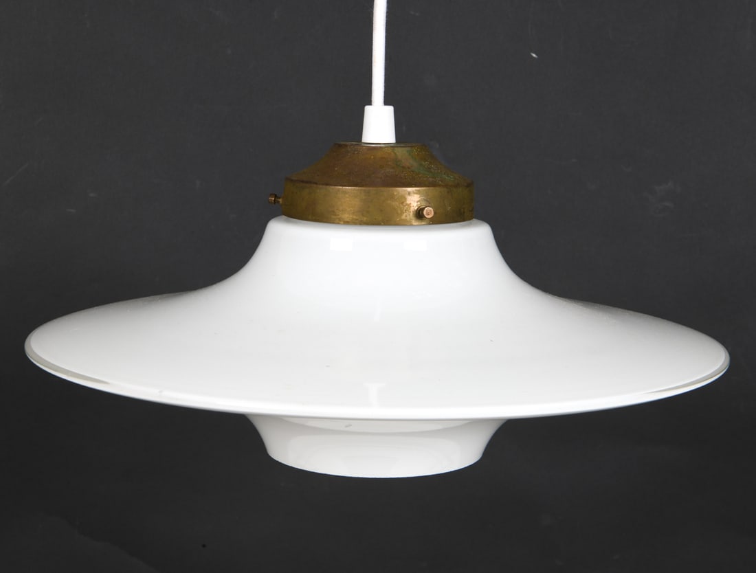 HOLMEGAARD STYLE UFO PENDANT LAMP: Glass pendant light in the style of Holmegaard. Denmark. Dimensions: H 8" x Dia 15" Condition: Flea bite chips to bottom rim. Wear consistent with age and use. Signs of patina to socket. Untested. E17