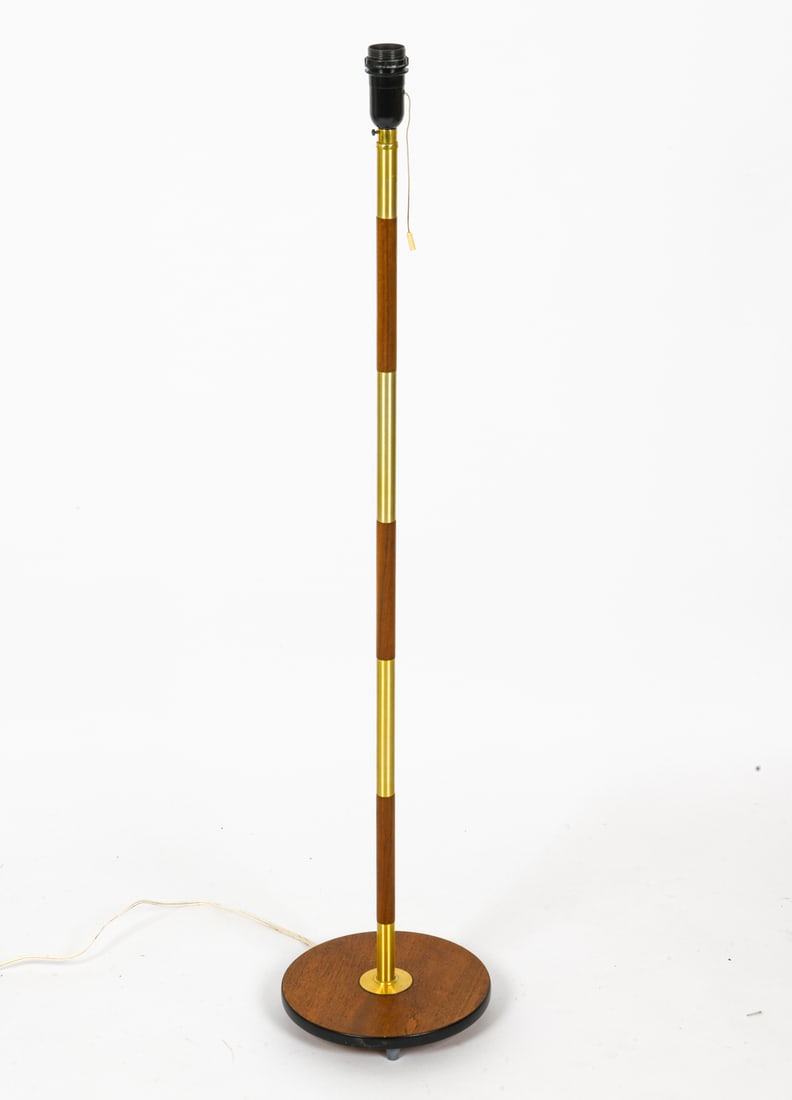 MID-CENTURY DANISH TEAK AND BRASS FLOOR LAMP: Vintage lamp with alternating sections of teak and brass. No shade included. Denmark. circa 1960s. Dimensions: H 47" x Dia 10" Condition: Wear consistent with use and age. Few minor scuffs. Missing pl