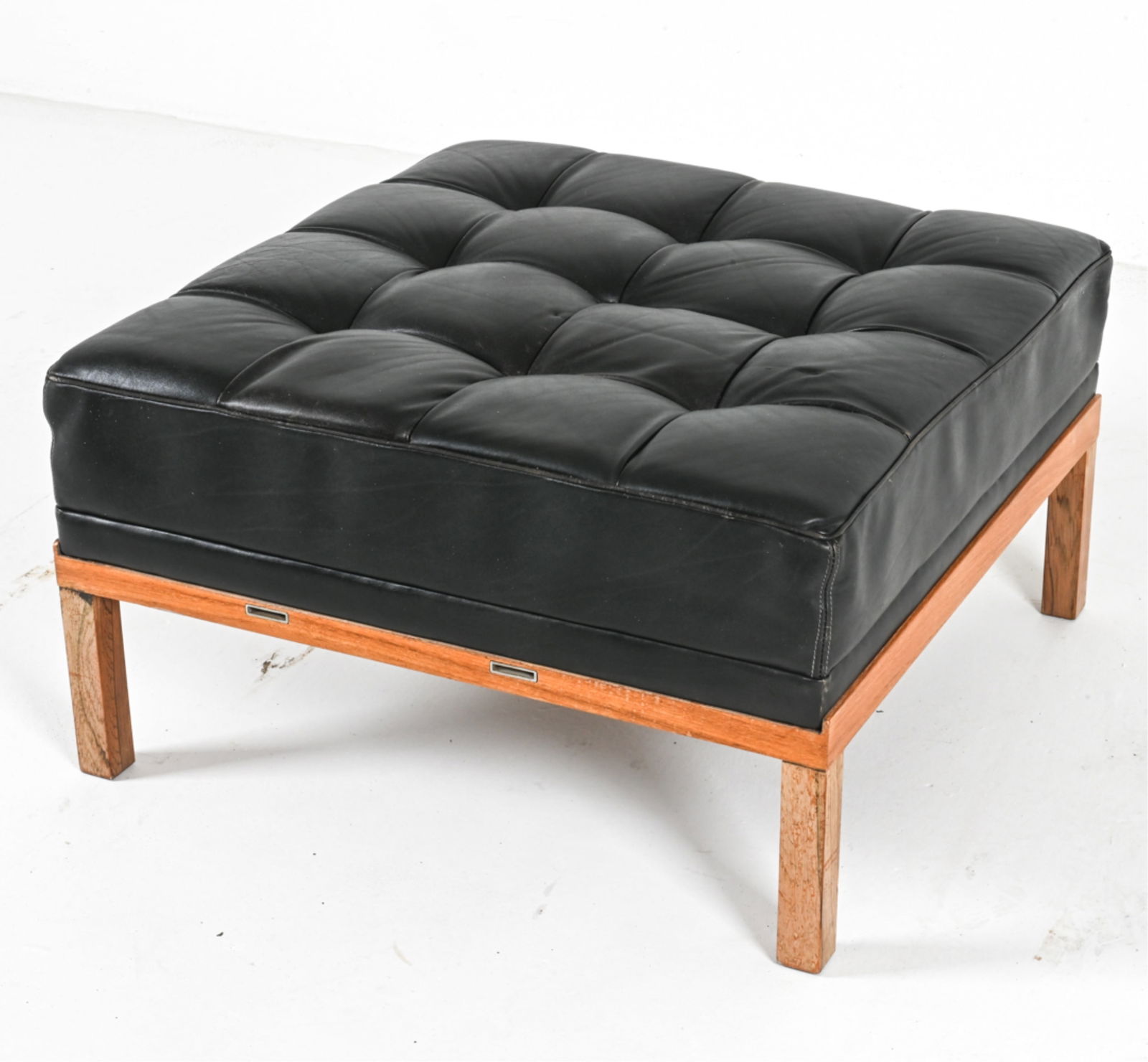 OAK AND LEATHER OTTOMAN BY ILLUMS BOLIGHUS: C.1970's. Dimensions: H 15.5" x W 27.5" x D 27.25". Condition: Some wear to leather, light scratches.