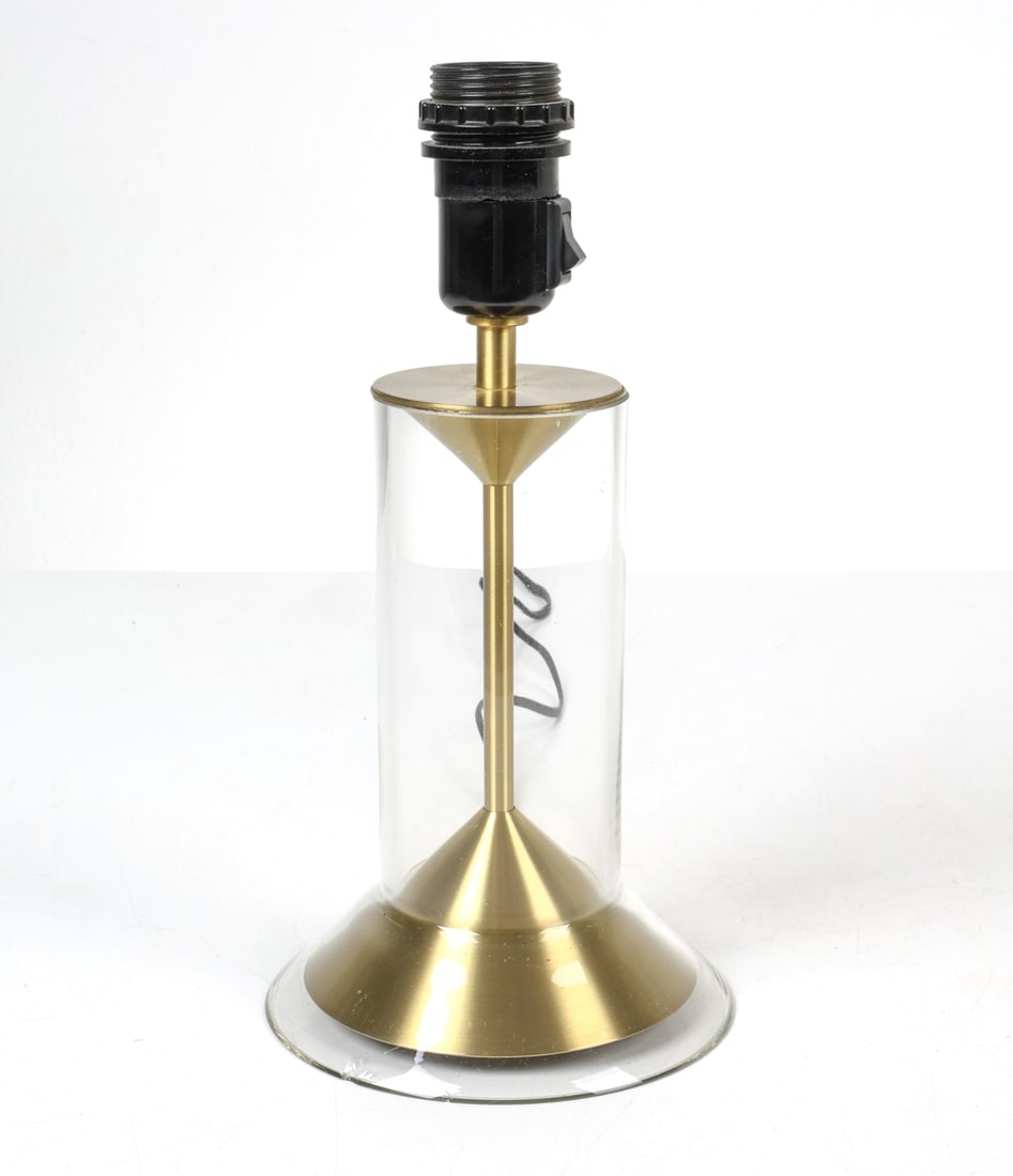 AAGE PETERSEN LE KLINT MODEL 303B GLASS TABLE LAMP: Glass and brass table lamp. Tagged under base. Denmark, circa 1960s. Dimensions: H 12.5" x Dia. 6". Condition: Wiring untested, European plug. Minor surface scratches to glass. Wear consistent with ag