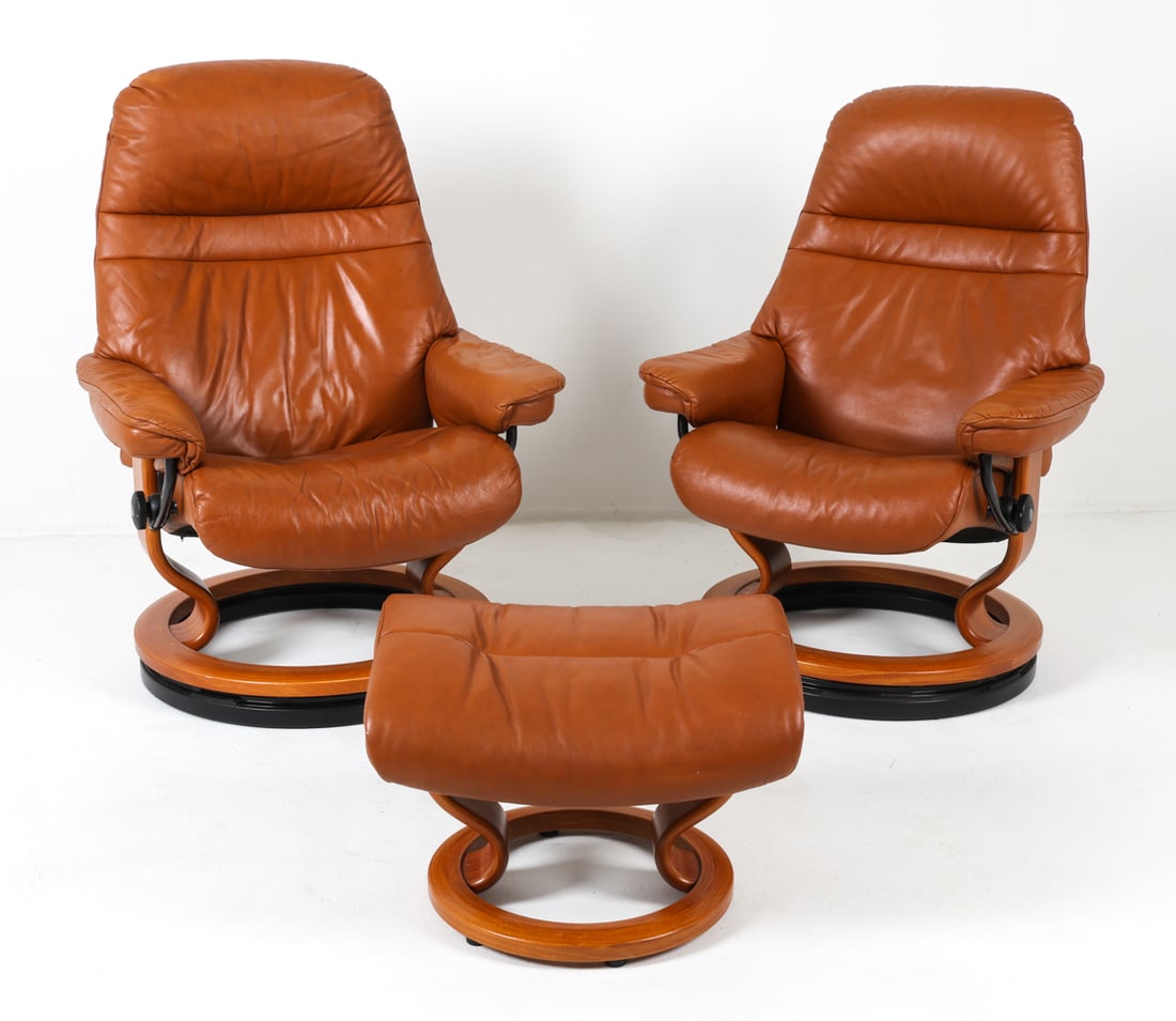 PAIR OF EKORNES 'STRESSLESS' RECLINERS & OTTOMAN: Pair of Ekornes 'Stressless' leather reclining lounge chairs. Together with (1) matching ottoman. Beech bentwood frames with cognac leather upholstery. Norway, circa 1990s. Dimensions: Chairs H 39" x