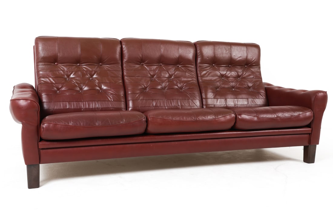 ARNE NORELL STYLE DANISH BROWN LEATHER SOFA 1970S: Tufted brown leather upholstery. Denmark, circa 1970s. Dimensions: H 34" x W 77" x D 26" x SH 14" Conditions: Minor scratches and rubs to wood and leather. Wear consistent with age and use. E155