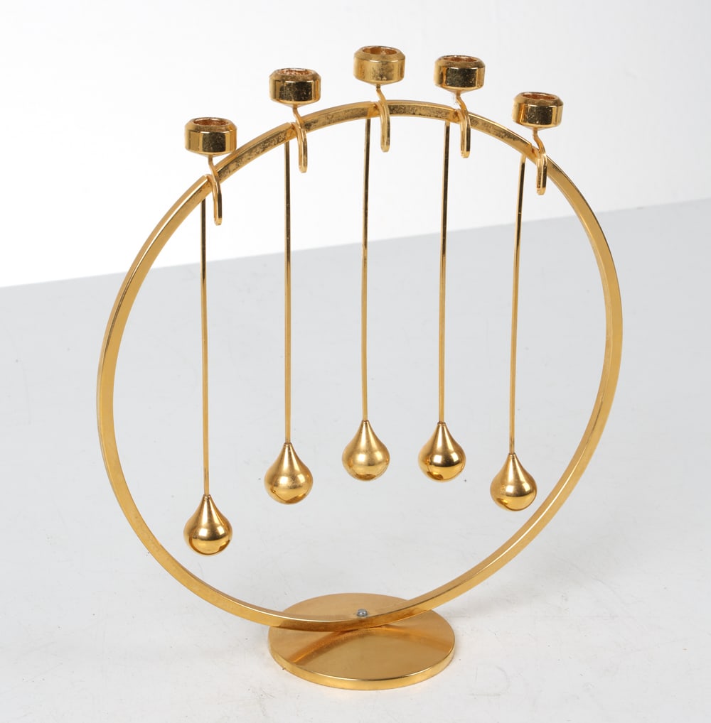 HUGO ASMUSSEN 24K GOLD PLATED CANDLE HOLDER: For Design Asmussen. 24 karat gold plated brass candleholder. Marked under the base. Denmark, circa 1970s. Dimensions: H 9" x W 8" x D 2.75". Condition: Wear consistent with age and display. E017