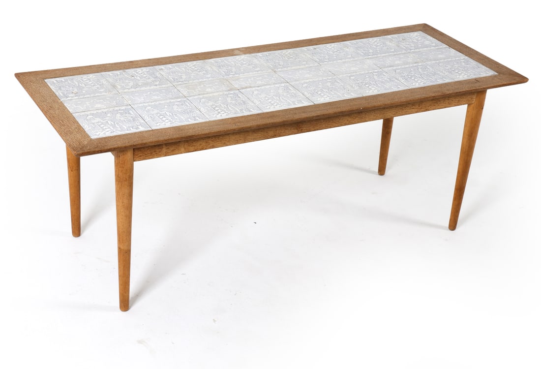 STYLE OF SEVERIN HANSEN OAK & CERAMIC COFFEE TABLE: Dimensions: H 19.75" x W 52.5" x D 19.5". Conditions: Dings and scratches to surface and legs. Few water spots. Wear consistent with age and use. E121