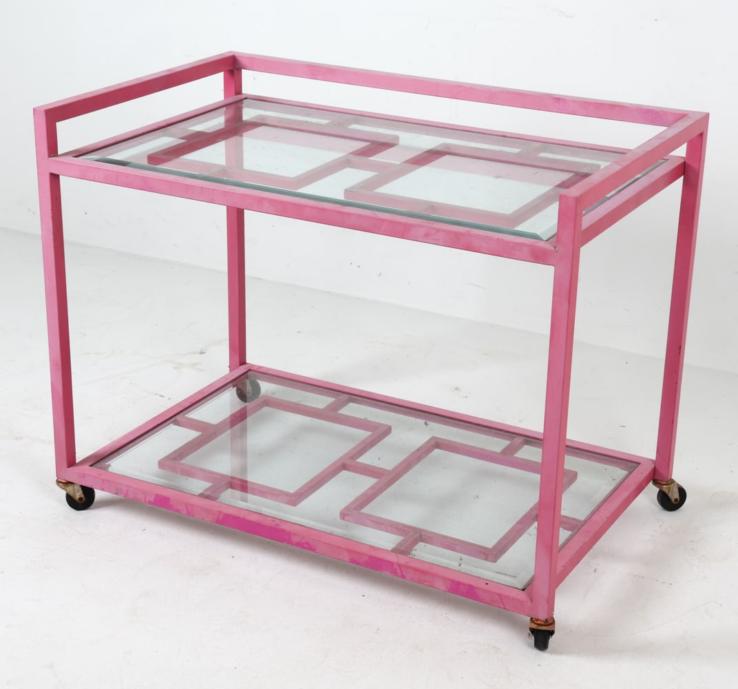 PINK METAL & GLASS SHELF BAR CART: Late 20th century. Dimensions: H 28.5" x W 36" x D 22.5". Condition: Fading to the paint, Scuffs and rubs to painted finish. Some rust to castor wheels. Wear consistent with age and use.