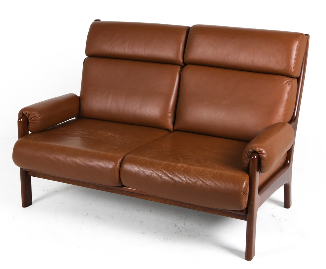 ARNE NORELL STYLE DANISH LEATHER & TEAK SOFA 1970S: Leather two-seat high back sofa with teak frame & removable leather armrests. Denmark, circa 1970s. Dimensions: H 37" x W 56" x D 35" x SH 17" Condition: Signs of wear, creasing to leather, scuffs and