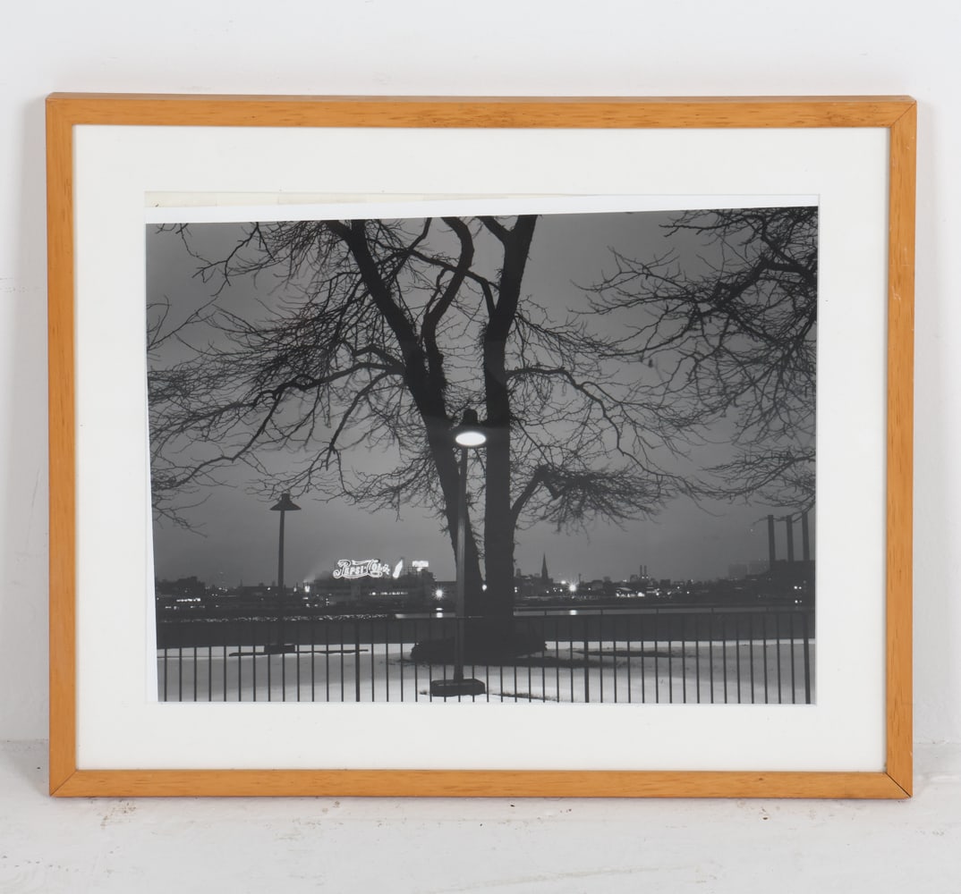 BOBBY SHEEHAN (20TH C.) NIGHT NYC PHOTO: Night time city scene depicting 'Pepsi Cola' sign in background. Dimensions: Frame H 20" x W 24". Sight H 14.5" x W 18.5". Condition: Not examined out of frame, photo slightly askew. No issues to note