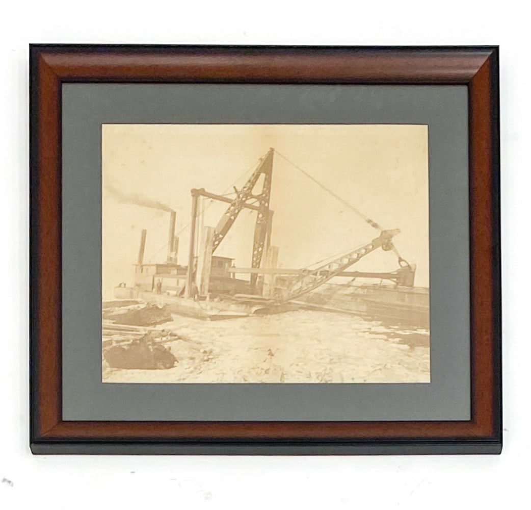 ANTIQUE PHOTOGRAPH OF A DREDGER AT WORK: Unsigned. Dimensions: (Frame) H 26.25" x W 30.25" (Sight) H 17" x W 21" Condition: Nicks to frame.