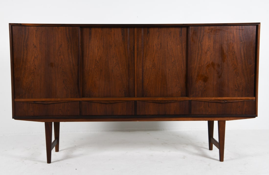 E. W. BACH DANISH ROSEWOOD SIDEBOARD C. 1960S: Design by E. W. Bach for Sejling Skabe. Elongated drawer pulls. Adjustable shelves. Felt lined drawers. Denmark, circa 1960s. Dimensions: H 45" x W 78" x D 18". Condition: Some light scratches, Wear c