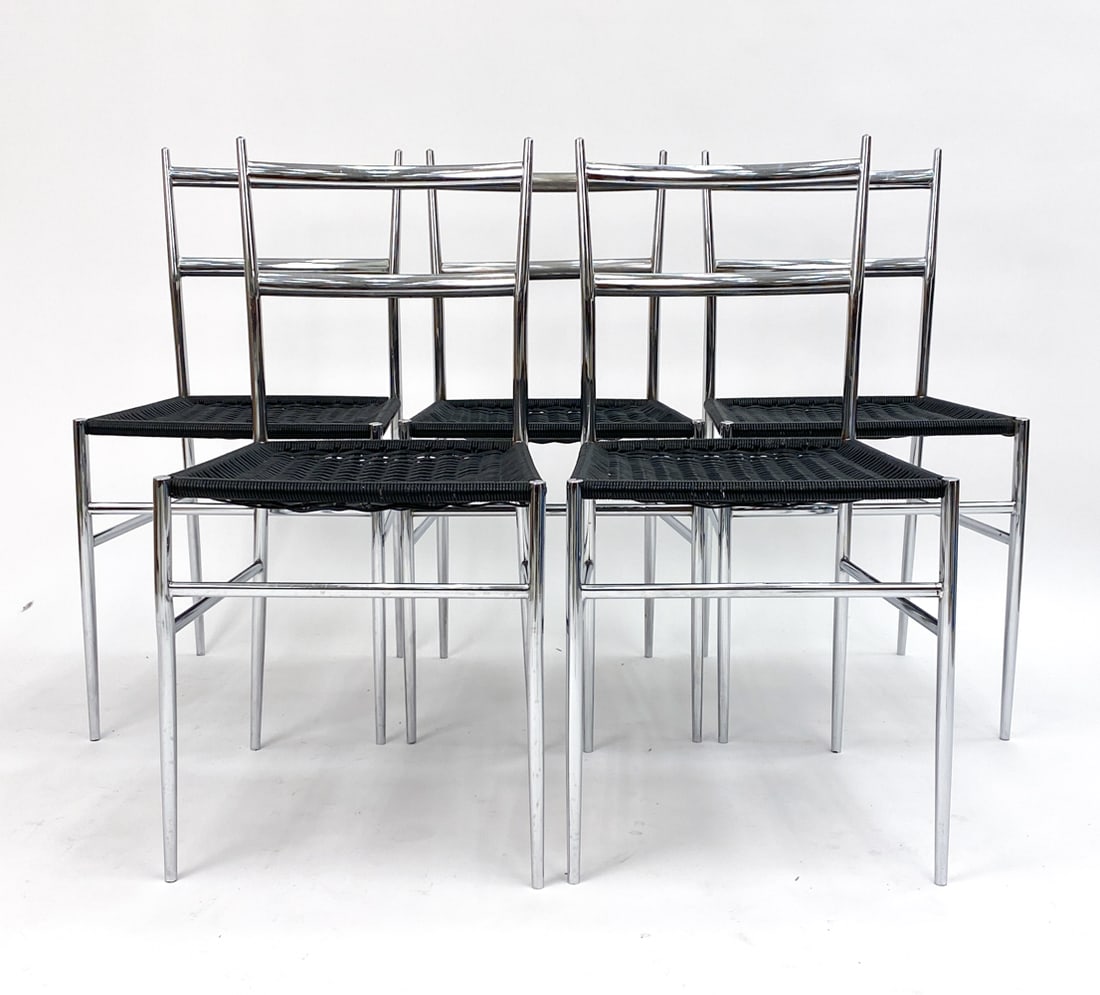 (5) PHILIPPE STARCK FOR DRIADE CHROME CHAIRS: Set of five chrome side chairs, model "Object Perdu" designed by Philippe Starck for production by Driade. Featuring black cord upholstery. Mid to late 20th century.Dimensions: H 32" x W 16" x D 16" x