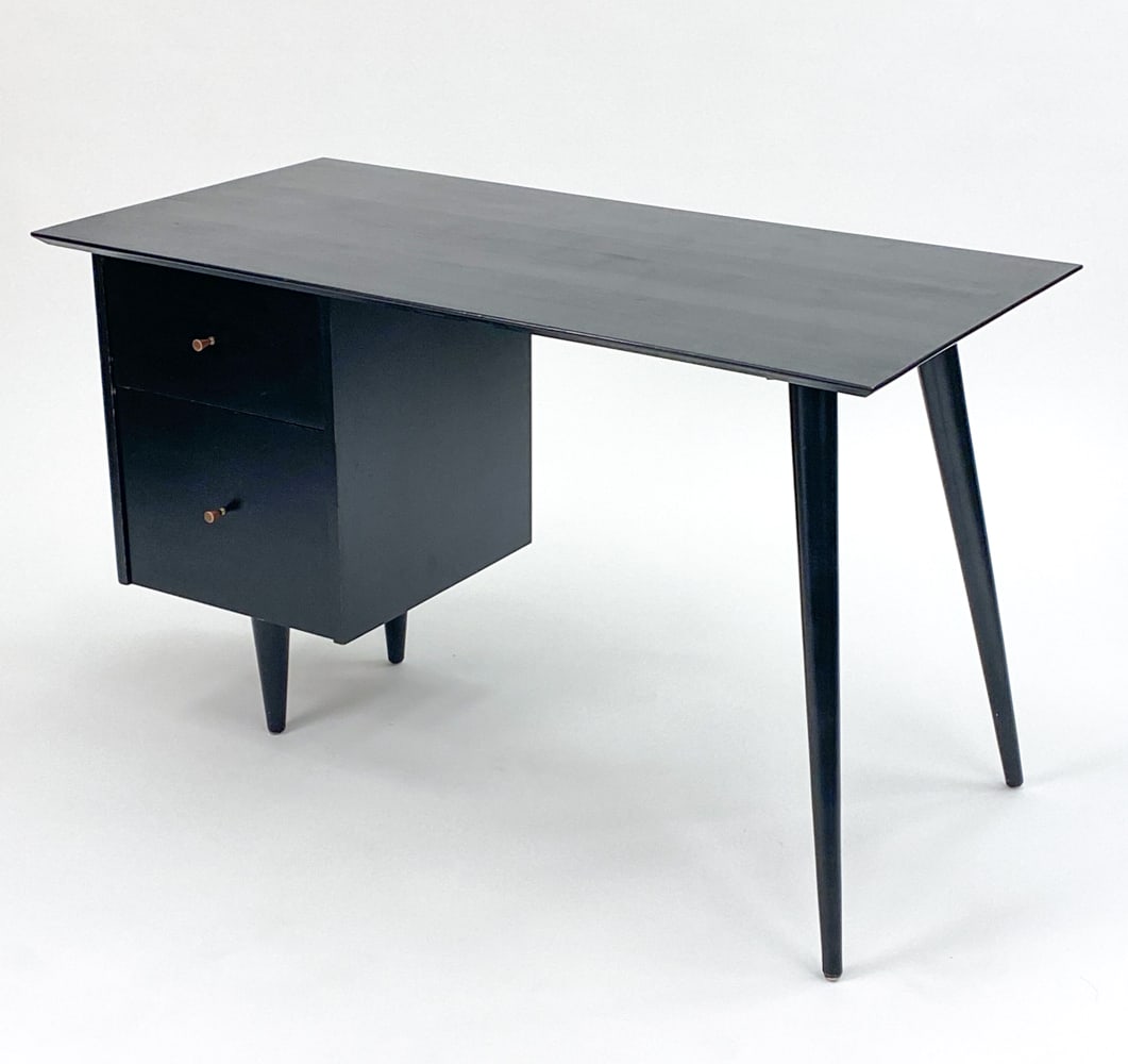 PAUL MCCOBB FOR WINCHENDON PLANNER GROUP DESK: Black painted desk with matching chair, petite legs and tapered pulls. Designed by Paul Mccobb for Winchendon Furniture Company, in Winchendon Massachusetts. Label inside top drawer.Dimensions: (Desk)
