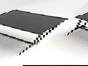 ITALIAN WALNUT & BRASS COFFEE TABLE C. 1950S: With tapered legs and brass crossbar. Originally created for the Galtrucco shop in Rome, Italy. Provenance: From Park Ave Manhattan Apartment designed by David Kleinberg. Dimensions: H 19.25" x W 59"