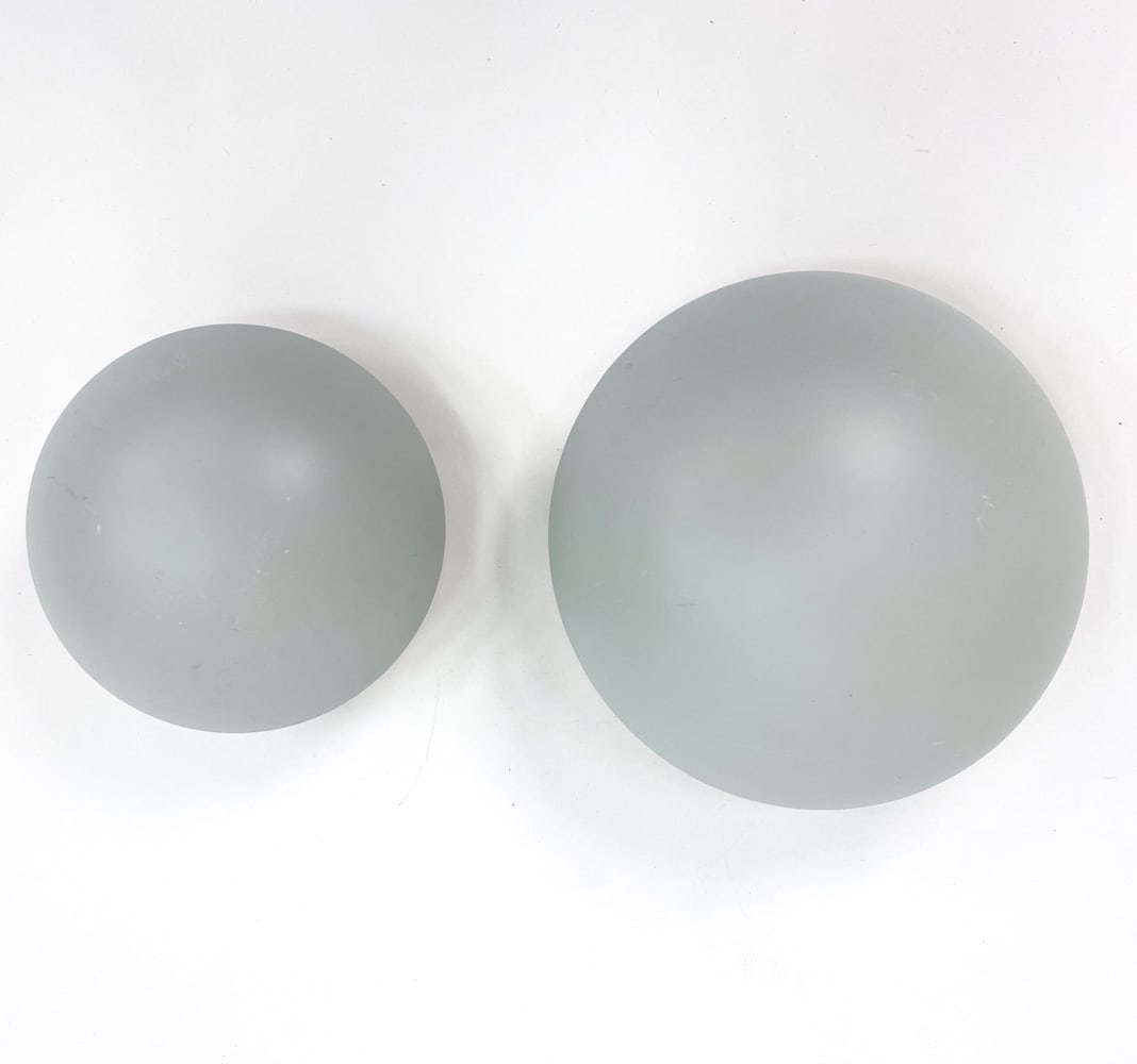 PAIR OF POUL HENNINGSEN FOR LOUIS POULSEN SCONCES: Vintage wall sconces designed by Poul Henningsen for Louis Poulsen. Features a matched pair of enameled metal sconces in two sizes. Labeled Louis Poulsen, made in Denmark. circa 1970s. Dimensions: (La