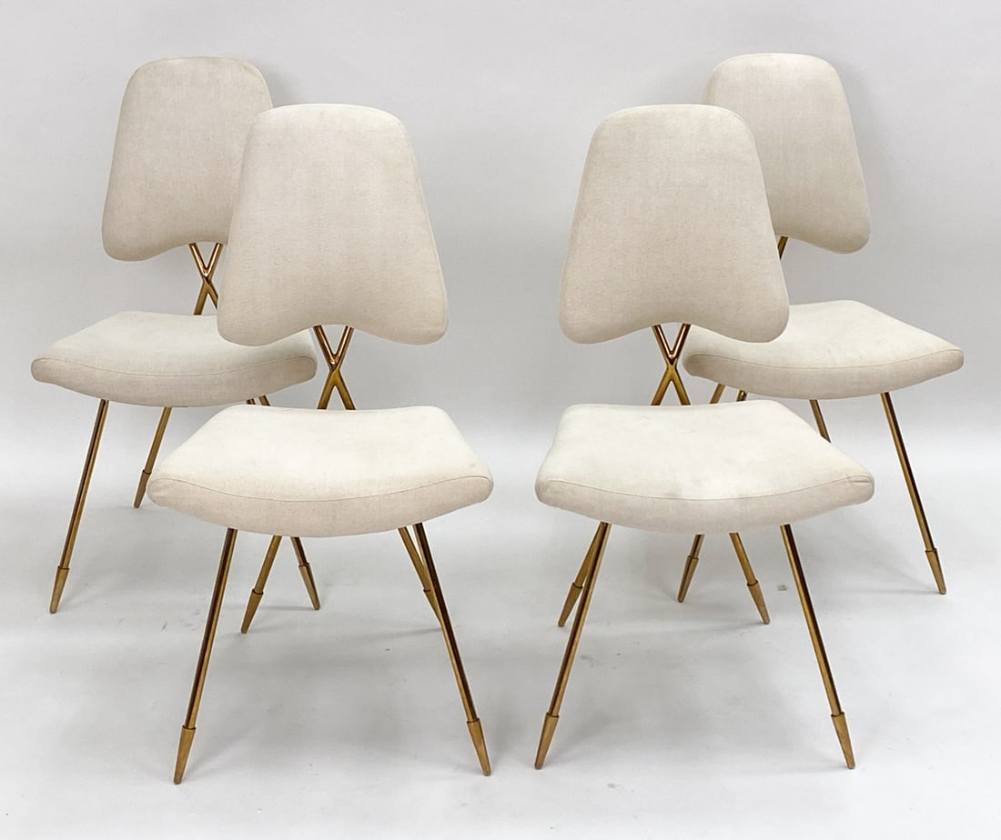 (4) JONATHAN ADLER MAXIME DINING CHAIRS: Set of four chairs featuring a sculptural brass frame with a white linen upholstery and minimalist designs. Label on undersides. Dimensions: H 31" x W 19.5" x D 20" x SH 18" Condition: Very light surf
