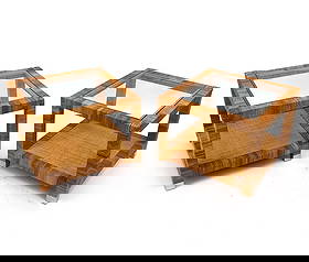 PAIR BIELECKY BROTHERS RATTAN & GLASS SIDE TABLES: Features a pair side tables with rattan wrapped sides, inset glass tops, and chrome capped feet. Stamped and labeled on undersides. 20th century. Dimensions: H 21.25" x W 23" x D 27" Condition: Light