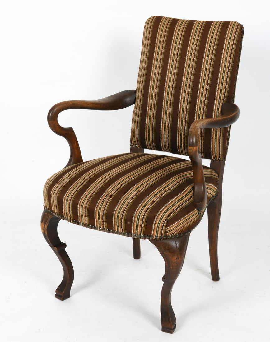 FRITS HENNINGSEN DANISH OAK ARMCHAIR: Upholstered armchair with striped fabric on a carved wood frame in a revival style. Features cabriole front legs, curved arms, and an upholstered back with nail-head trim. European, 20th century. Dime