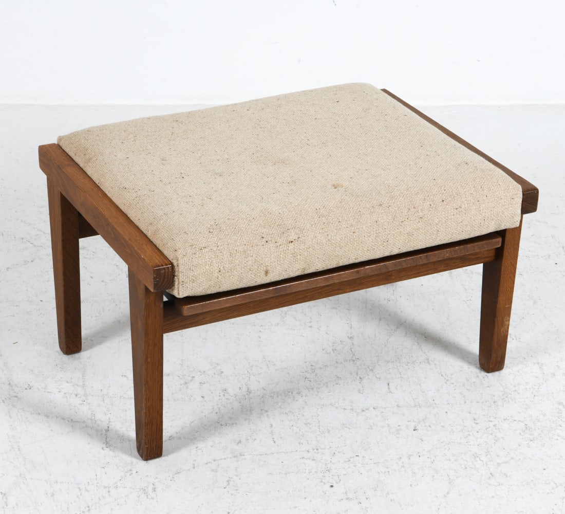 HANS WEGNER GE-375 OAK OTTOMAN C. 1970S: For Getama. Marked underneath. Oak frame with wool upholstery. Denmark, circa 1970s. Dimensions: H 15" x W 25.25" x D 19.75" Condition: Minor marks to upholstery. Wear consistent with age and use.