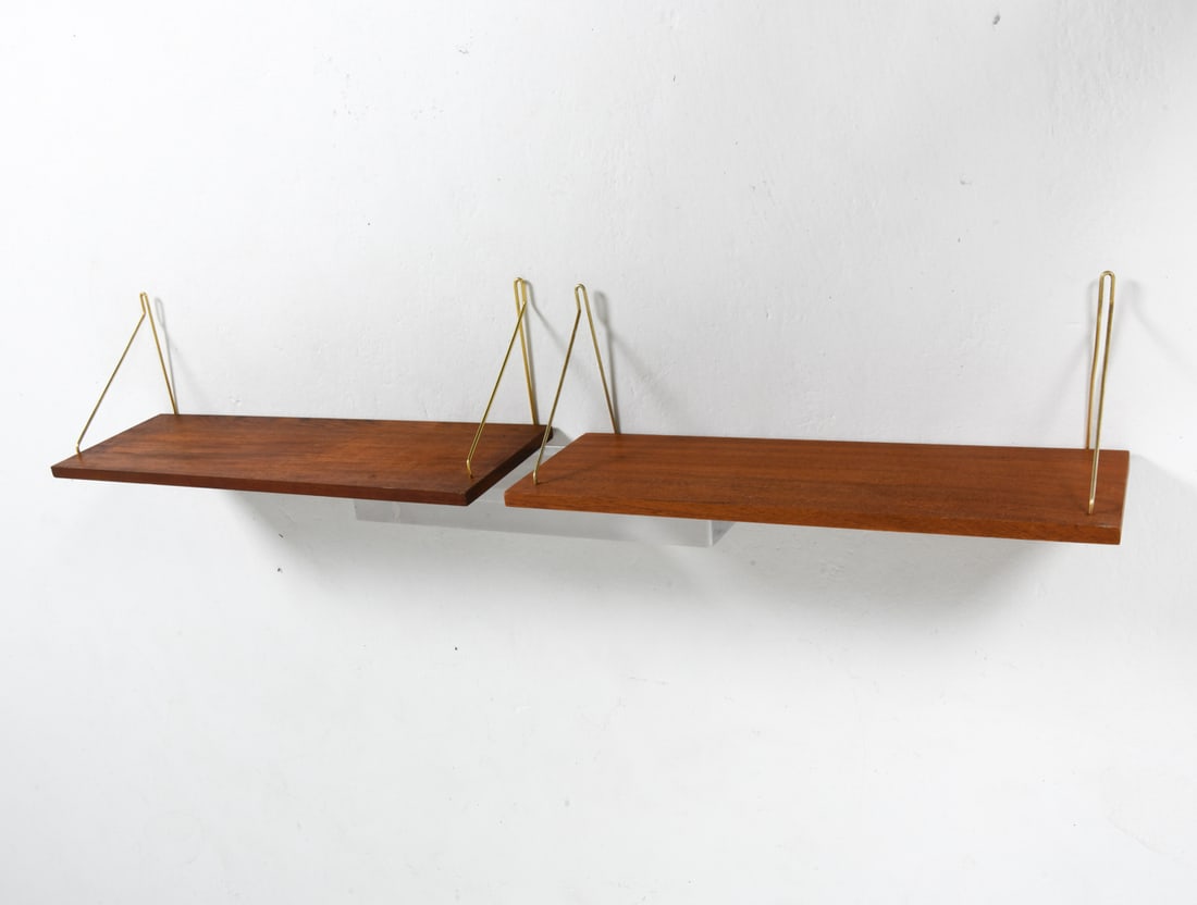 (2) DANISH TEAK WALL SHELVES C. 1960S: Group of (2) teak wall shelves with brass brackets. Denmark, circa 1960s. Dimensions: Largest L 25.75" x D 8.75". Condition: Minor scuffs to wood, wear consistent with age and use.