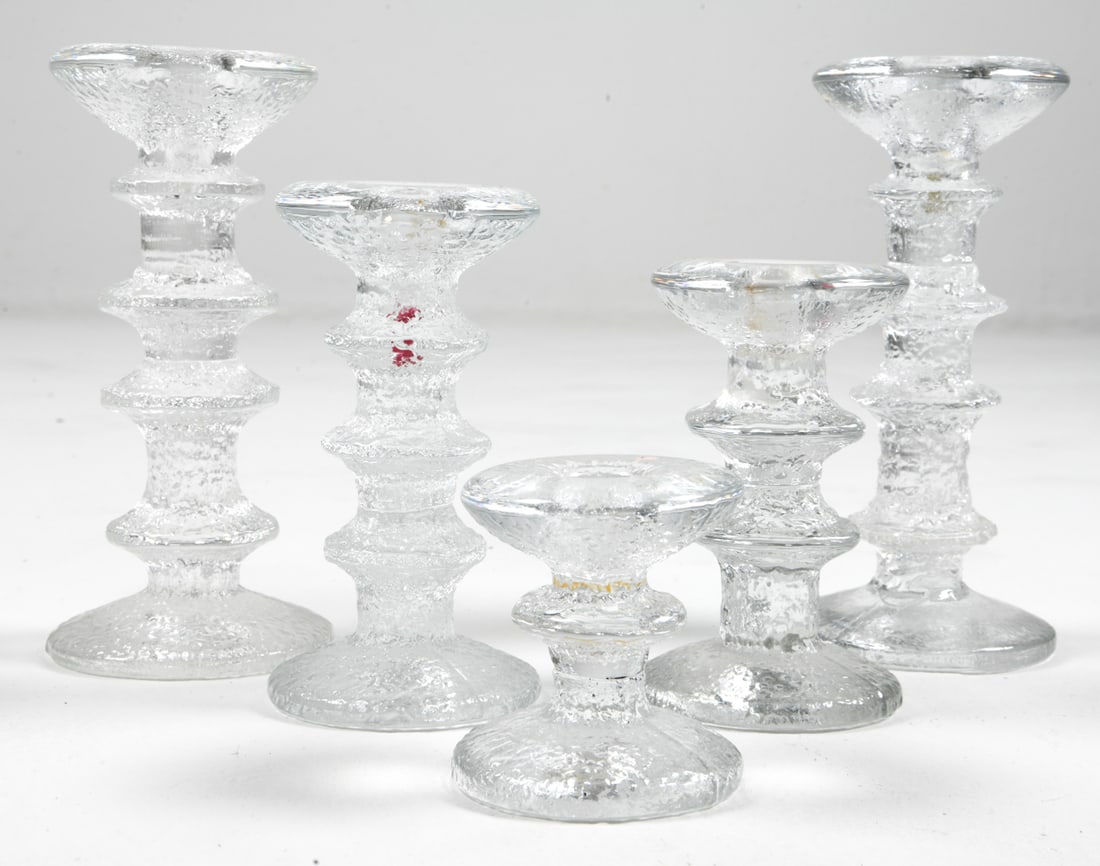ITTALA FESTIVO GLASS CANDLE HOLDER GROUPING: Grouping of (5) candle holders. Designed by Timo Sarpaneva. Signed under base and few tagged to tops. Finland, late 20th century. Dimensions: Tallest H 7.5" x Dia. 3.25". Condition: Minor scuffs, Wear
