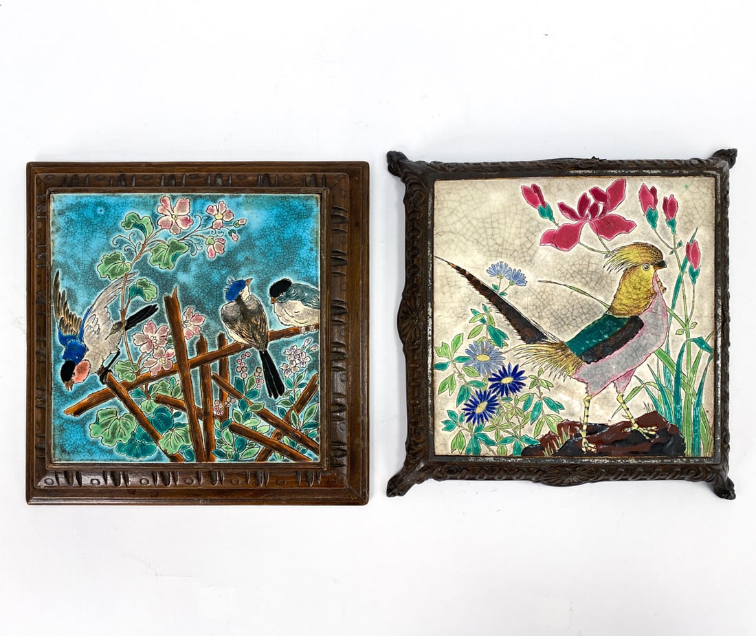 ANTIQUE FRENCH EMAUX DE LONGWY PORCELAIN TRIVETS: (2) cloissonne style French trivets with hand-painted bird and floral decor with crackle glazes. One on a metal stand and another on wooden. Wooden framed trivet is signed on backside. Dimensions: (La