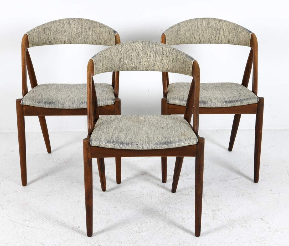 (3) KAI KRISTIANSEN ROSEWOOD & WOOL DINING CHAIRS: Rosewood frames with wool upholstery. Apparently unmarked. Denmark, circa 1960s. Dimensions: H 29" x W 20" x D 20" x SH 17". Condition: Minor scuffs and dings to wood. Wear consistent with age and use