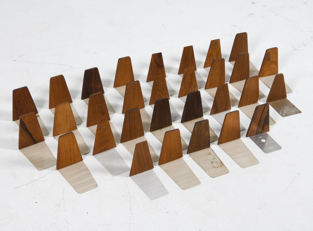 KAI KRISTIANSEN DANISH TEAK & ROSEWOOD BOOKENDS: Teak & rosewood bookends with metal bases. Denmark, circa 1960s. Dimensions: H 5.75" x W 3.75" x D 6". Condition: Minor scuffs to wood and metal. Wear consistent with age and use.