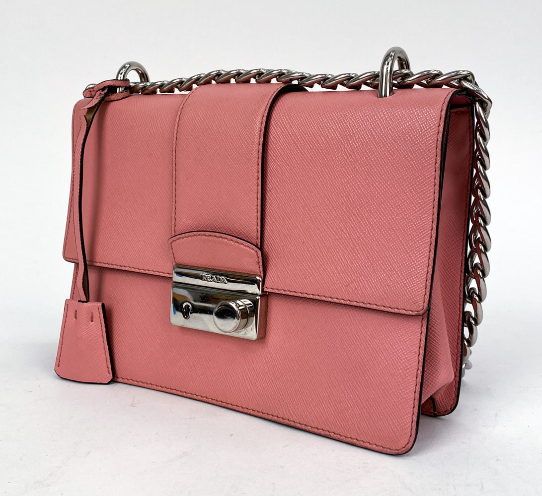 PRADA PINK SAFFIANO CHAIN SHOULDER BAG: Prada Saffiano leather shoulder/crossbody bag in petal pink. Featuring metal clasp with Prada logo and a combination of chain with leather strap. Dimensions: H 6.5" x W 8.5" x D 1.5" (Strap) H 20" Con