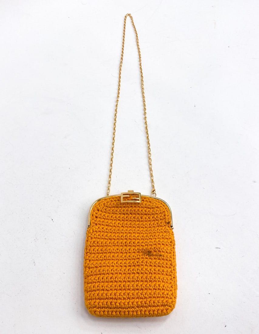 FENDI ORANGE BAGUETTE WOVEN CROCHET PHONE BAG: Featuring gold-tone closure and chain-link shoulder strap. Serial #7AR966 AFGX 218-0501. Dimensions: H 8" x W 6" x D 0.5" (Strap drop) H 21.5" Condition: Soiling spot to surface. Wear consistent with