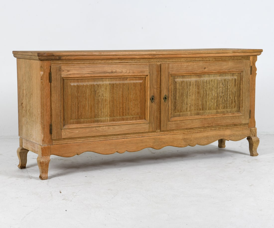 HENNING KJAERNULF STYLE DANISH OAK SIDEBOARD 1970S: Key included. Adjustable shelves. Denmark, circa 1970s. Dimensions: H 27.5" x W 60" x D 16.25". Condition: Wear consistent with age and use, including rubs and scuffs. EN152
