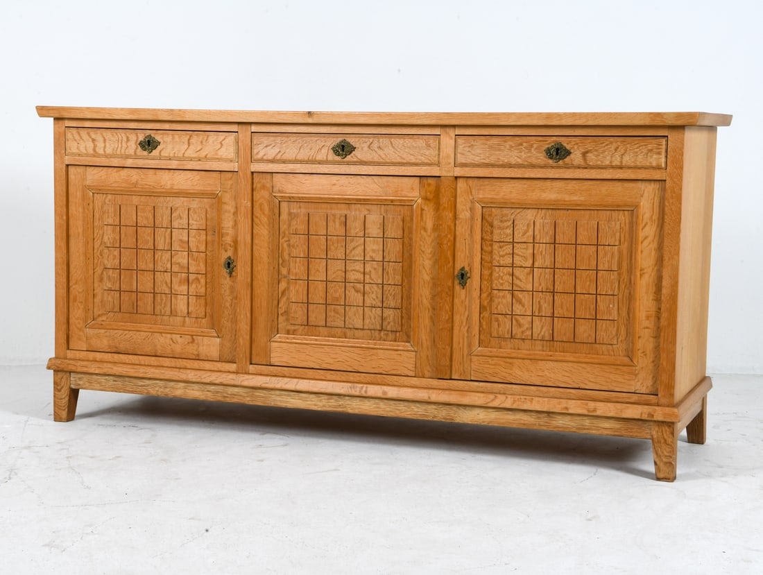 HENNING KJAERNULF STYLE DANISH OAK SIDEBOARD 1970S: Key Included. Adjustable shelves. Denmark, circa 1970s. Dimensions: H 30.5" x W 62.25" x D 18.5". Condition: Wear consistent with age and use, including rubs and scuffs, sun-fading to top. EN173