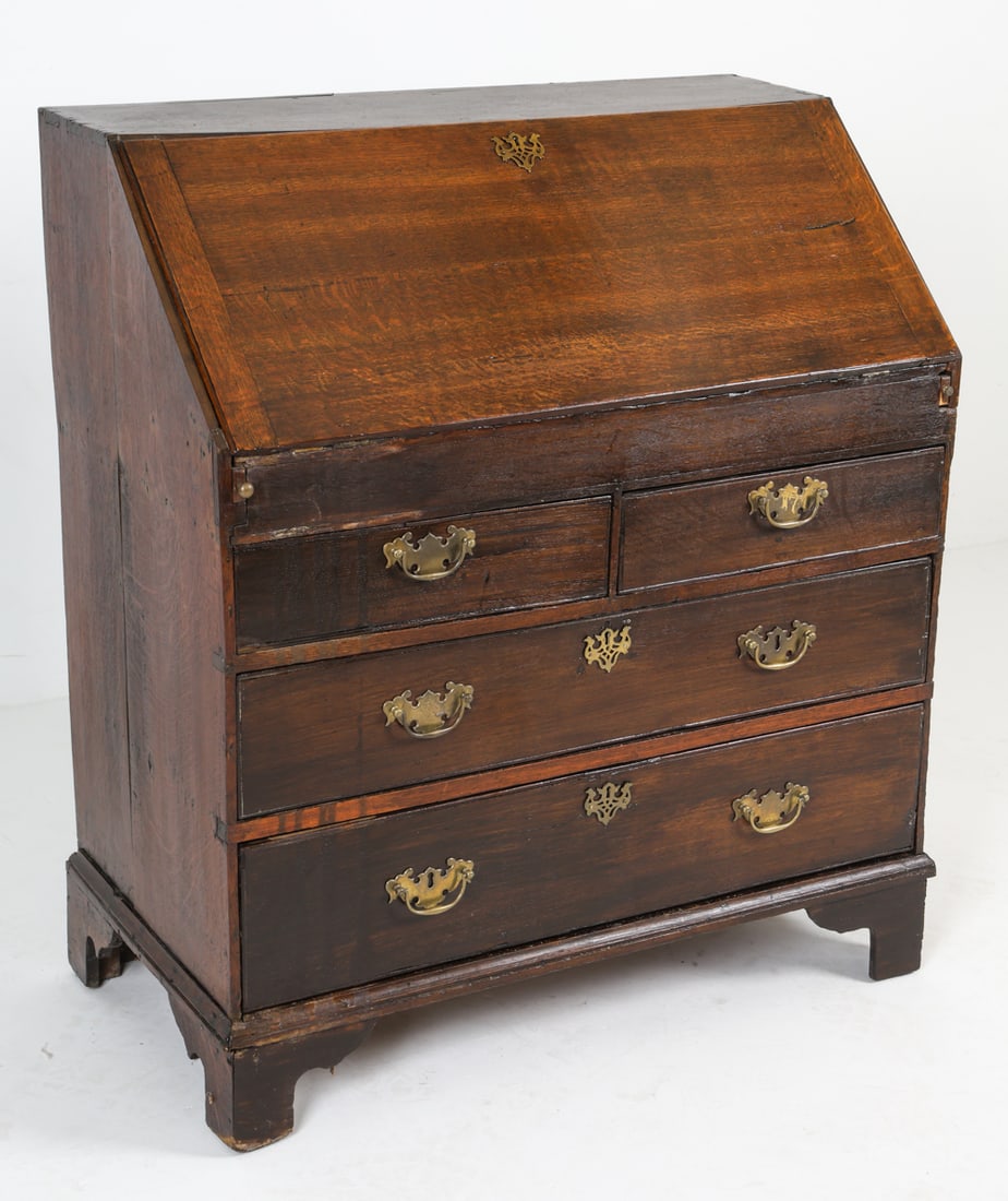 GEORGE III STYLE MAHOGANY SECRETARY DESK: Slant-front secretary desk. Mahogany with brass drawer pulls. Late 18th or early 19th century. Dimensions: H 43" x W 38" x D 20.5". Condition: Scuffs, scratches, and rubs. Wear consistent with age and