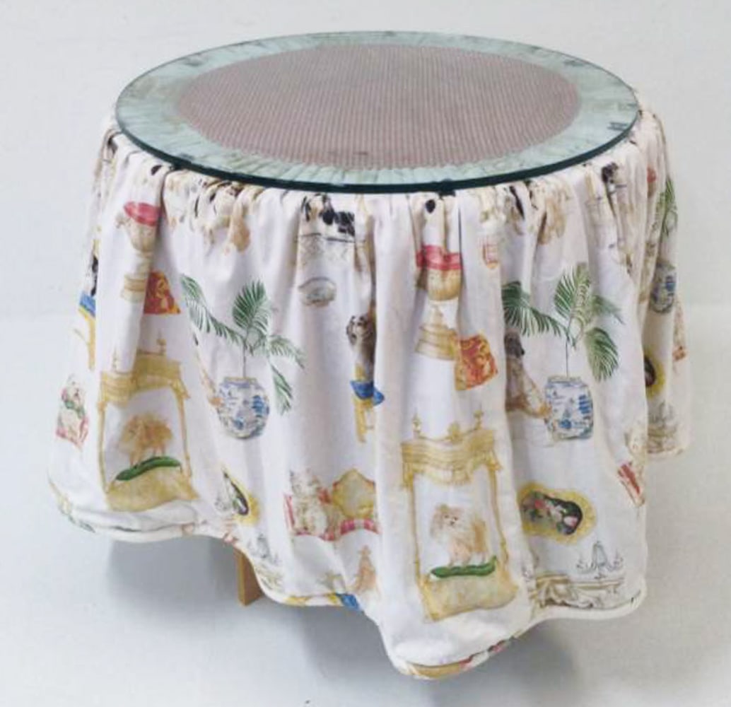 PAINTED FLOWER TOP SIDE TABLE WITH SKIRT: Vintage side table with flower painted to top. Dimensions: H 33" x Dia. 32". Condition: Wear consistent with age and use.